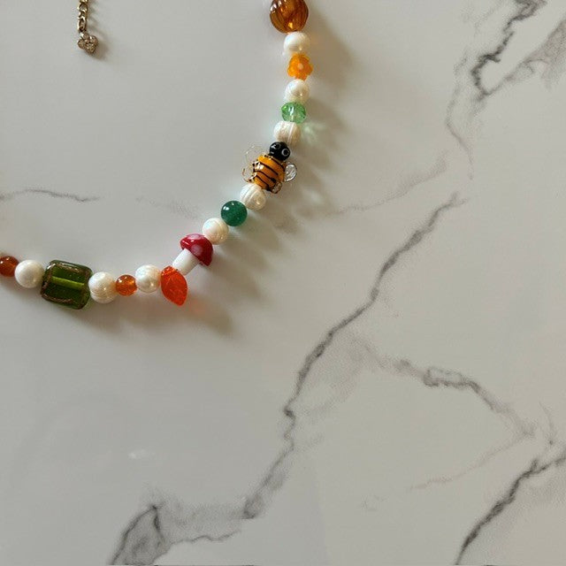 the bee’s knees • half beaded half pearl necklace