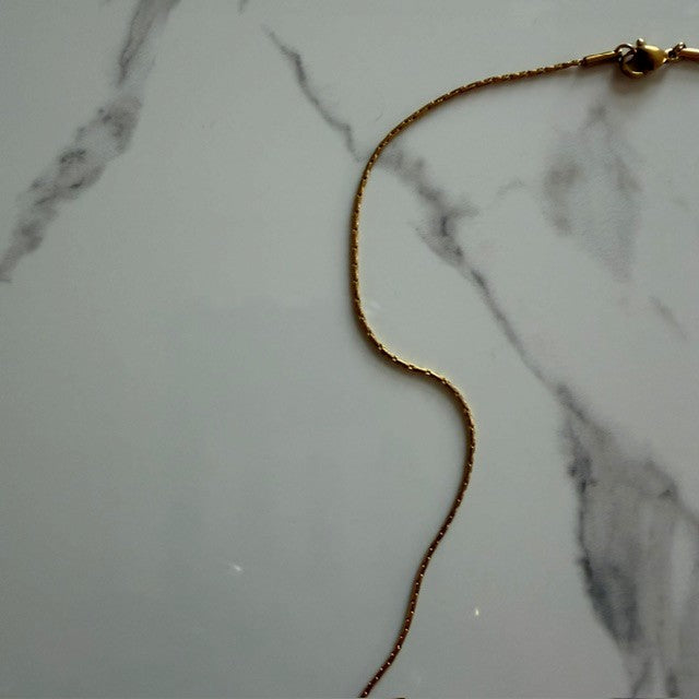 bow tie ghost · gold plated snake chain